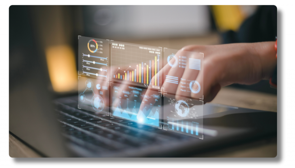 Man typing on computer with graphs coming up